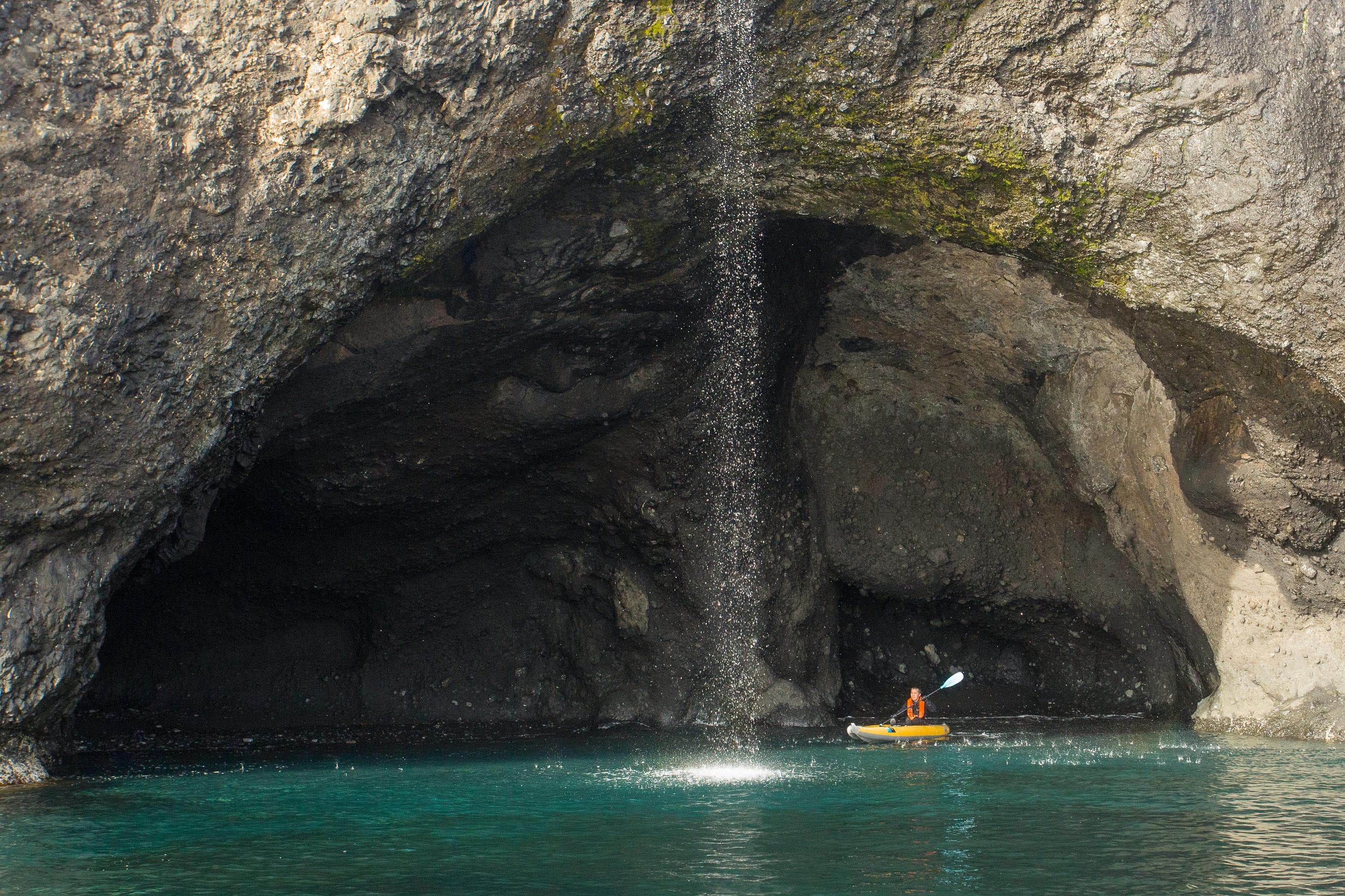 A guest from the ship National Geographic Explorer explores by kayak in Ellesmere Island, Nunavut, Canada